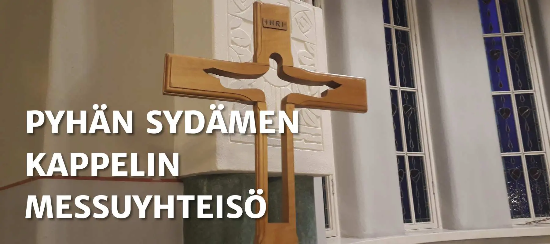 Kuvassa on Sleyn Pyhän sydämen kappeli ja kulkueristi